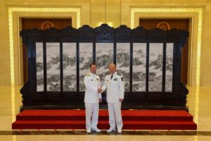 Commander of the Chinese navy, Admiral Wu Shengli (R) shakes hands with U.S. Chief of Naval Operations Admiral John Richardson during a welcome ceremony held at the Chinese Navy Headquarters in Beijing, China, July 18, 2016.