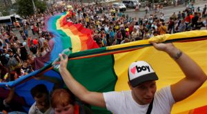 Participants hold a giant rainbow flag during the Prague Pride Parade where thousands marched through the city center in support of gay rights, in Czech Republic