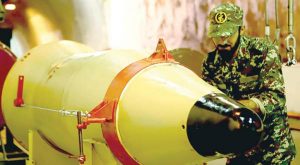 IRGC member inspecting an underground ballistic missile last March, AFP IRGC member inspecting an underground ballistic missile