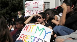 Berkeley High student Moria Godes holds a sign saying 'Not My President' during a protest in response to the election of Republican Donald Trump as President of the United States in Berkeley, California