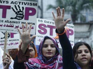 LAHORE, PUNJAB, PAKISTAN - 2015/12/10: Pakistani activists of women workers hold placards and shout slogans during a protest marked as "16 days activism Stop Violence against Women" in Lahore. (Photo by Rana Sajid Hussain/Pacific Press/LightRocket via Getty Images)