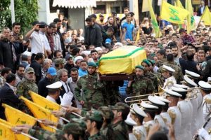 Members and supporters of Lebanon's Shiite militant group Hezbollah carry the coffin of Mustafa Badreddine, a top Hezbollah commander who was killed in an attack in Syria, during his funeral in the Ghobeiry neighbourhood of southern Beirut on May 13, 2016. Hezbollah announced that Badreddine had been killed in an attack in Syria where the Shiite militant group has deployed thousands of fighters in support of the Damascus regime. The group said it was still investigating the cause of the blast near Damascus airport but it did not immediately point the finger at Israel as it did when the commander's predecessor was assassinated in the Syrian capital in 2008. / AFP PHOTO / ANWAR AMRO