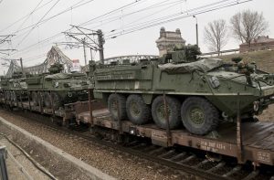 US military armored vehicles are transported on a freight train near the Black Sea port of Constanta, Romania