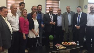 Retired Saudi general Anwar Eshki (center, in striped tie) and members of his delegation, meeting with Knesset members and others during a visit to Israel, on July 22, 2016