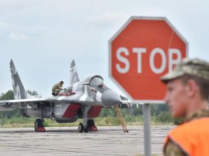 A technician prepares a Ukrainian MIG-29 fighter jet ahead of a training exercise last month