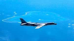 a Chinese H-6K bomber patrols the islands and reefs in the South China Sea. (Liu Rui/Xinhua via AP)