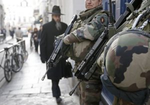 French soldiers patrol the street in a Jewish neighbourhood near a religious school and a synagogue as part of the highest level of "Vigipirate" security plan after the Islamist attacks in Paris January 20, 2015