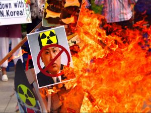 South Korean protestors burn Kin Jong Un signs